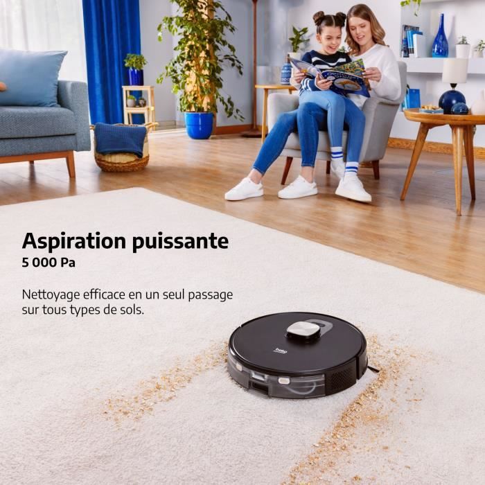 Aspirateur robot Beko VRR94314VB nettoyant un tapis souillé avec des traces de saleté