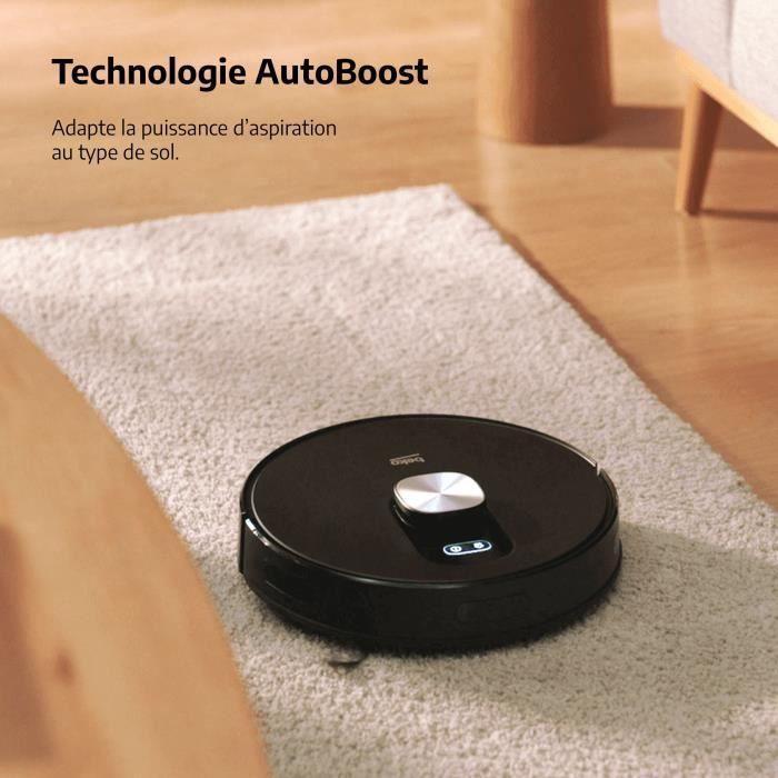 Aspirateur robot Beko VRR94314VB circulaire sur un tapis, efficace et autonome