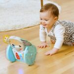 BABY EINSTEIN Little Elephant Rolling Toy, Music and Lights, Interactive and Multilingual, Motor Skills Development - Image 3