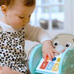 BABY EINSTEIN Little Elephant Rolling Toy, Music and Lights, Interactive and Multilingual, Motor Skills Development - Image 5